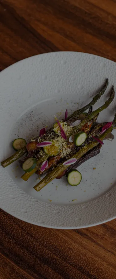 A white plate topped with asparagus and radishes, a pastel by Martin Desjardins, featured on pexels, superflat, rendered in unreal engine, made of cheese, made of vines