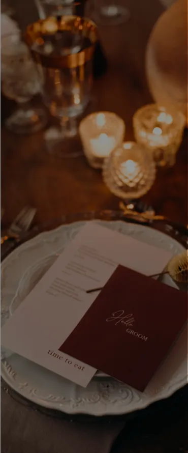 A table setting with a menu and candles, a still life by Ottilie Maclaren Wallace, featured on dribble, private press, shot on 70mm, elegant, rich color palette